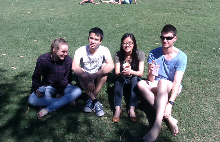 Four young musicians of the 2012 AYO String Quartet smile at the camera.