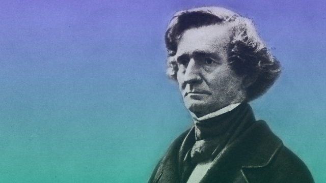 Greyscale photo of Hector Berlioz, superimposed on a blue-green background.