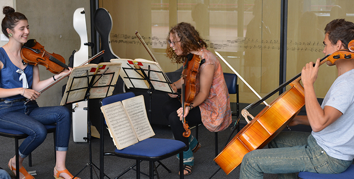 A string trio rehearses during AYO National Music Camp 2014.