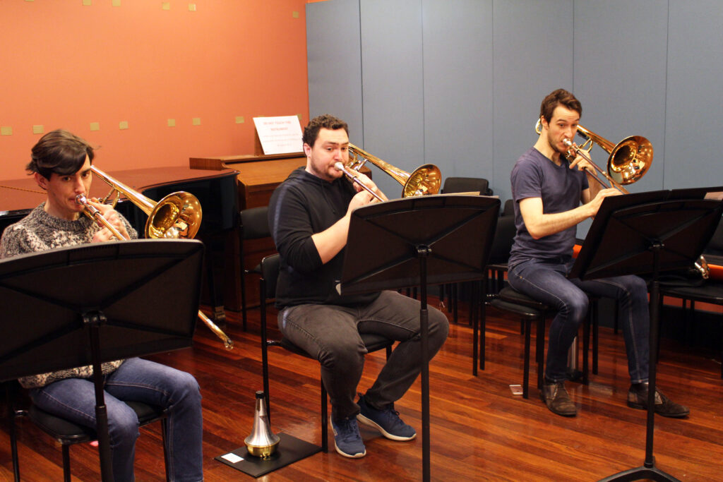 Trombone players of the Australian Youth Orchestra rehearse during a tutorial in 2018.