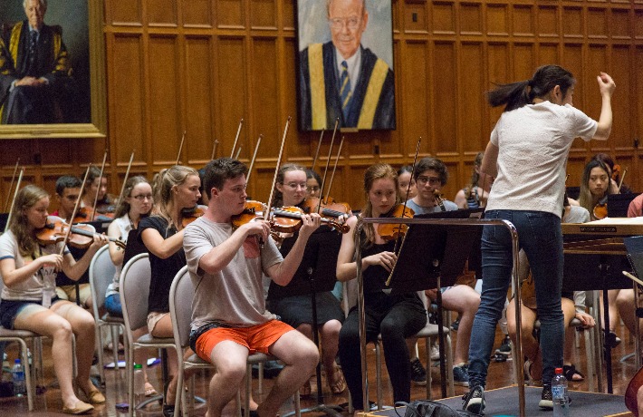 Conductor Elim Chan leads the Alexander Orchestra in a rehearsal at AYO National Music Camp 2017.