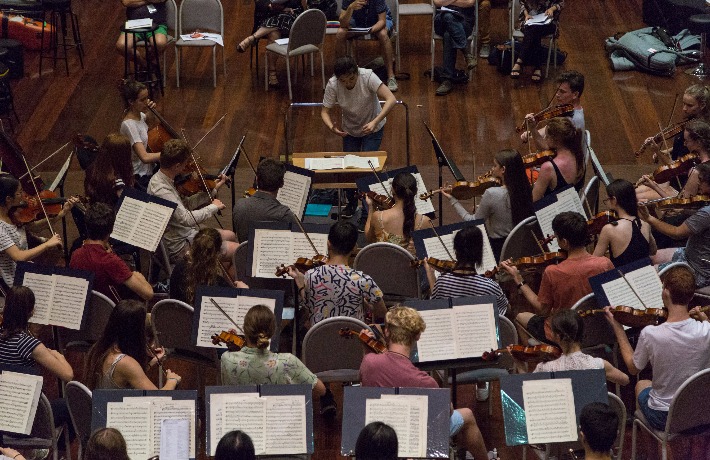 Conductor Elim Chan leads the Alexander Orchestra in a rehearsal at AYO National Music Camp 2017.