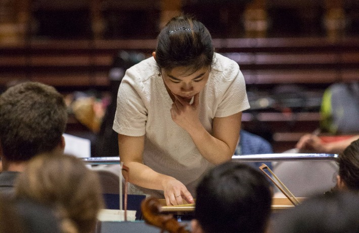 Conductor Elim Chan leads the Alexander Orchestra in a rehearsal at AYO National Music Camp 2017.