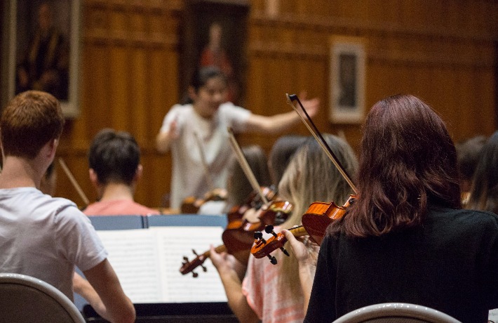 Conductor Elim Chan leads the Alexander Orchestra in a rehearsal at AYO National Music Camp 2017.