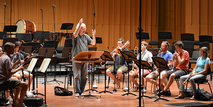 Music educator and conductor Richard Gill leads an ensemble during AYO National Music Camp 2014.