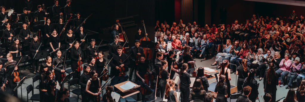 A collage of rehearsal and performance photos from AYO Young Symphonists 2023.