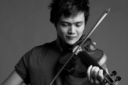 Black and white picture of Yukhi Mayne playing violin.