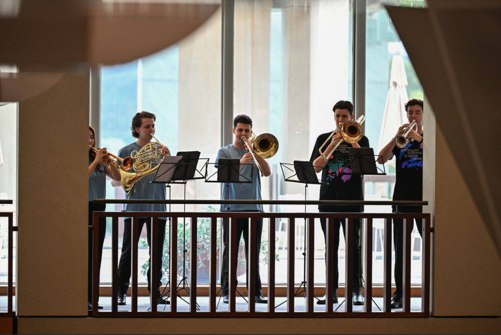 A brass quintet of AYO and ANAM musicians performs in the foyer of Australian parliament.